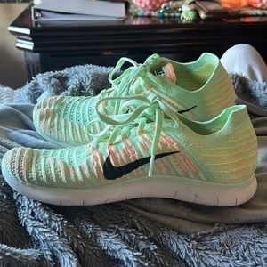 Nike running shoes neon green and orange